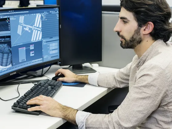 Photo of a student working at a computer.