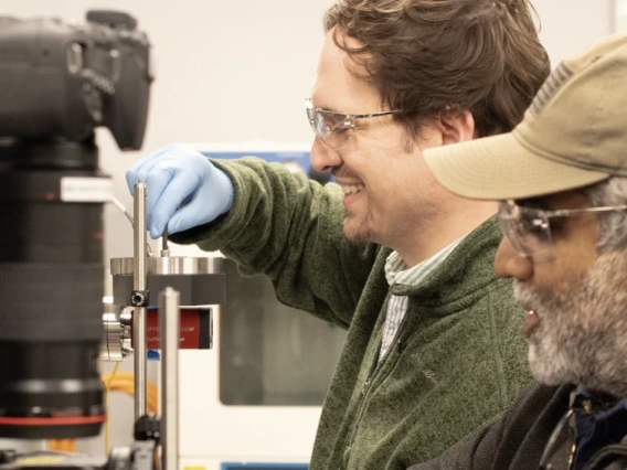 Photo of Adam Battle and Vishnu Reddy in the lab.