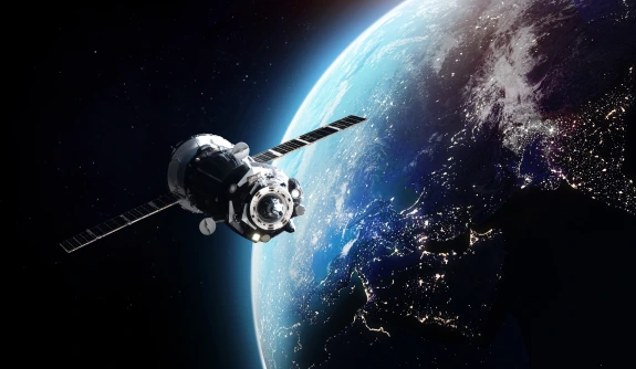Stock image of a spacecraft orbiting Earth.
