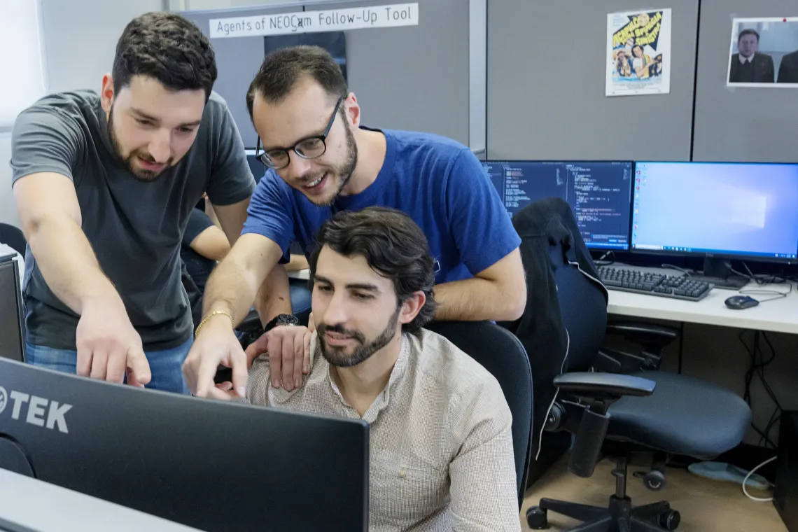 Photo of students working in a computer lab.