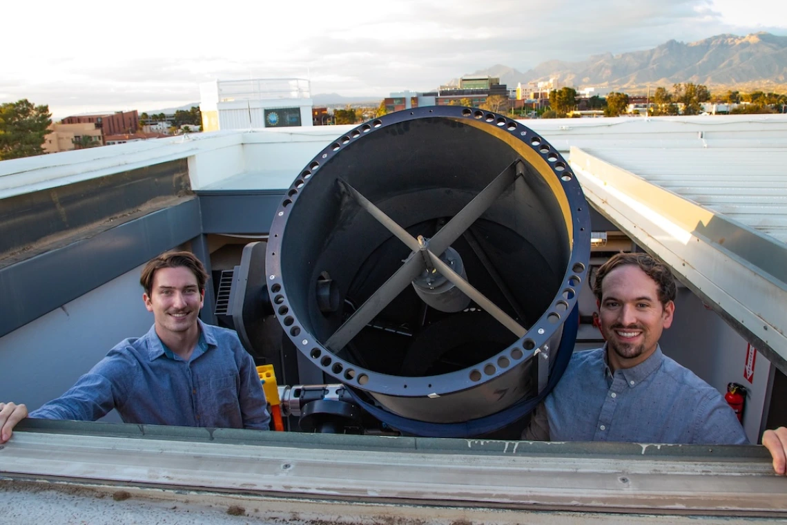 Photo of David Cantillo and Adam Battle with the RAPTORS telescope