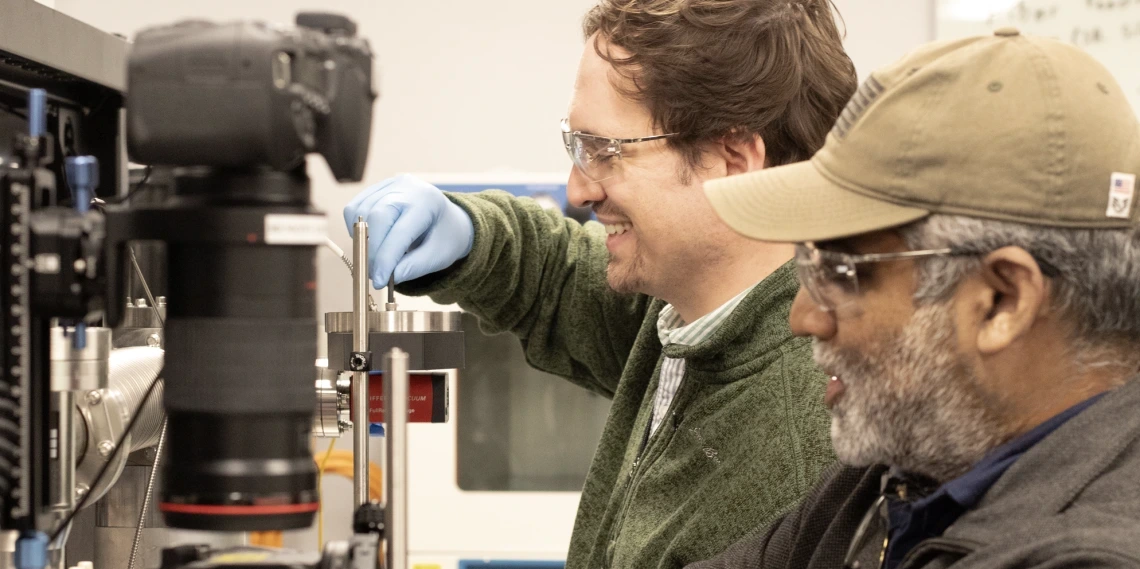 Photo of Adam Battle and Vishnu Reddy in the lab.